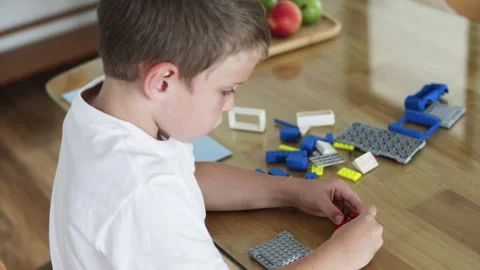 Preschool boy playing with constructor. Stock Footage 265543739