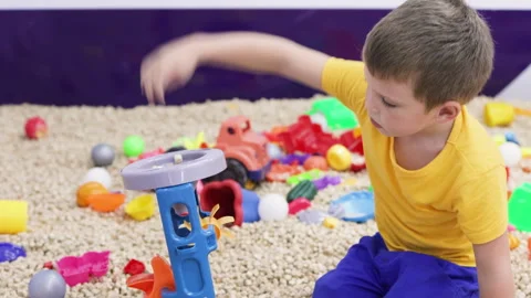 Preschool boy playing in sandbox. Stock Footage 265051913