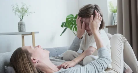 Preschool boy sharing secrets with his mother and having fun communicating. Vídeo Stock 162479453
