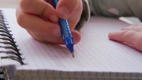 Preschool child draws elements with pen in lined notebook, Writing Before S.. Stock Footage 251760675