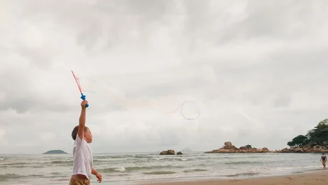 Preschool kid making big bubble. Stock Footage 273281362