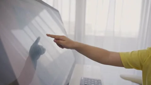 Preschool kid touching the screen of computer during online education Stock Footage 246086564