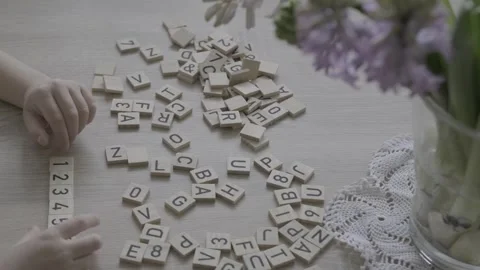 Preschooler learning to count, Child studying numbers on wooden squares, Ma.. Video stock 317699477