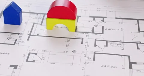 Preschooler puts colored constructor on drawing of apartment Stockbeeldmateriaal 244374765