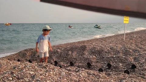 Preschooler walking on the seashore Stock Footage 201215712
