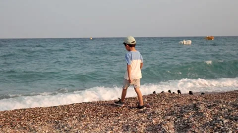 Preschooler walking on the seashore Stock Footage 201215999