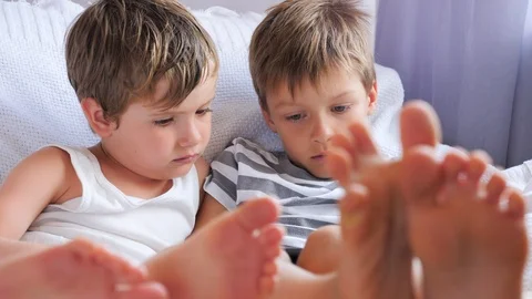 Preschoolers with wireless gadget. Boring studying. Children get bored. Children Stock Footage 101389205
