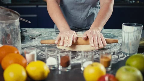 Prescriptive video of female hands rolling out the dough. Stock Footage 239772734