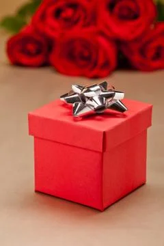 Present  and roses Stock Photos