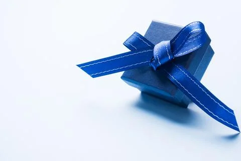 Present blue box on light background greeting card holidays concept. Copy spa Foto stock