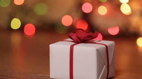 Present box against blurry lights Stock Footage 70302860