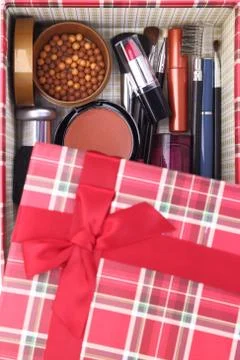 Present box with cosmetics inside Stock Photos