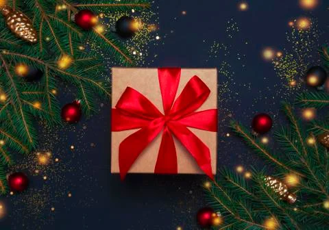 Present box with decorations on blue background Stock Photos