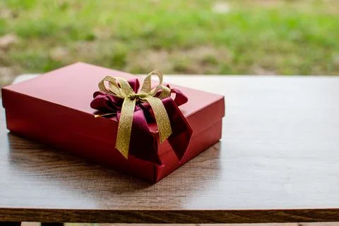 The present box has a copyspace on the left. For writing a greeting There i.. Stock Photos
