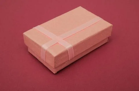 Present box Red gift box with gold bow isolated on white Copyright: xZoona... Stock Photos