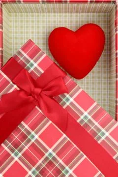 Present box with red heart inside Stock Photos