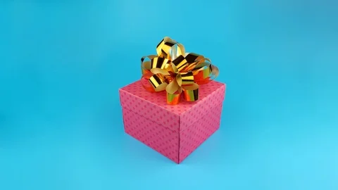 Present box with surprise, Rabbit, shows tongue, isolated, blue background Stock Footage 96583731