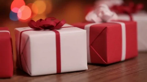 Present boxes against blurry lights Stock Footage 70302879