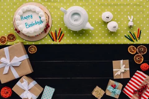 Present boxes and birthday cake Stock Photos
