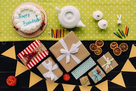 Present boxes and birthday cake Stock Photos