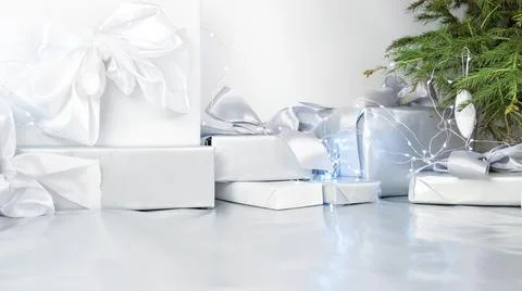 Present. Boxes with bows on a gray background. Festive decorations.	 Stock Photos