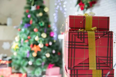 Present boxes at christmas tree. happy new year. celebrate xmas at home. wint Stock Photos