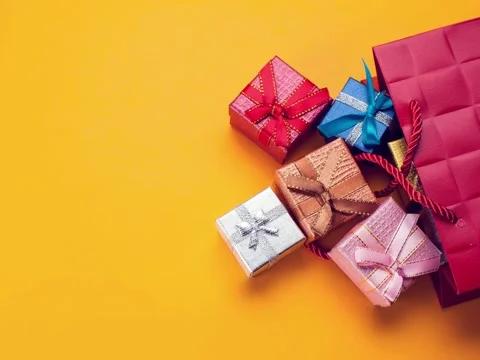 Present Boxes moving into a gift  packet Stock Footage 140781070