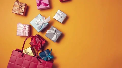 Present Boxes moving into a gift packet.Holiday and celebration concept. Stock Footage 142898196
