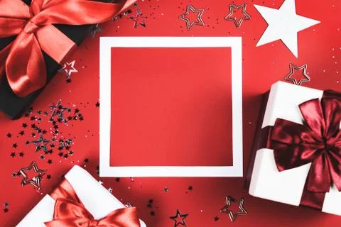 Present boxes on red background. Stock Photos