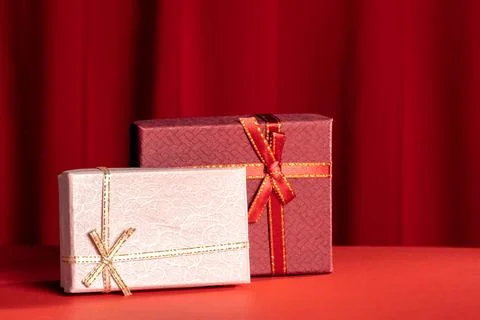 Present boxes on red background. Stock Photos