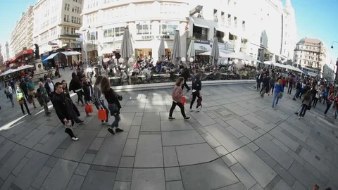 Present day street in Vienna with its new and old buildings, tourists in summer Stock Footage