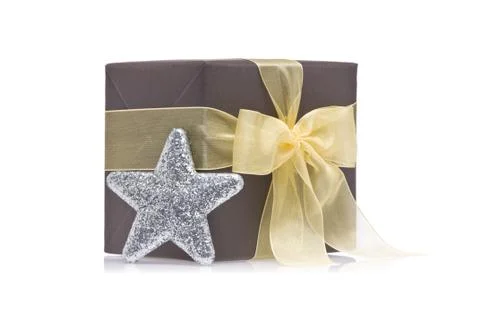 Present decorated with a glitter star Stock Photos
