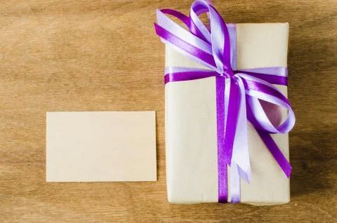 Present with Empty Tag on Wooden Background. 스톡 사진