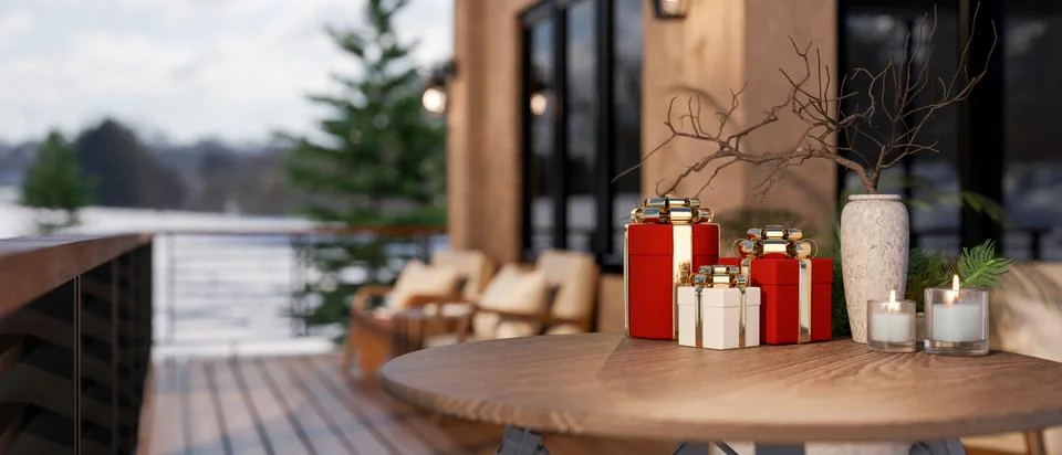 Present gift box and candles on round wooden table across sofa at balcony o.. Stock Illustration