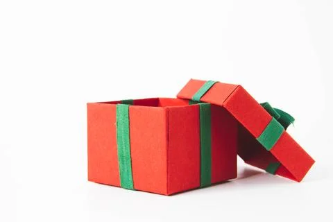 Present. Gift box with a bow. New Year's surprise. Red and green box with a.. Stock Photos