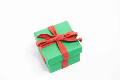Present. Gift box with a bow. New Year's surprise. Red and green box with a.. Stock Photos