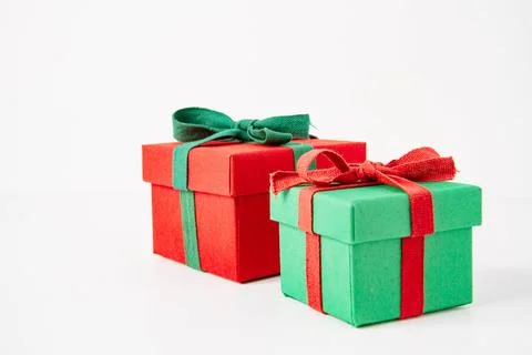 Present. Gift box with a bow. New Year's surprise. Red and green box with a.. Stock Photos