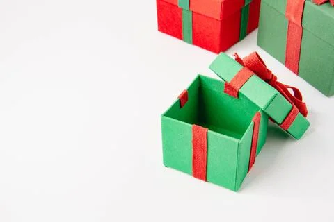 Present. Gift box with a bow. New Year's surprise. Red and green box with a.. Stock Photos