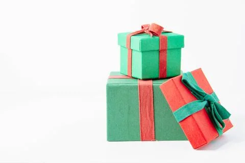 Present. Gift box with a bow. New Year's surprise. Red and green box with a.. Stock Photos