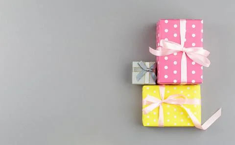 Present in gift paper on the table. Stock Photos