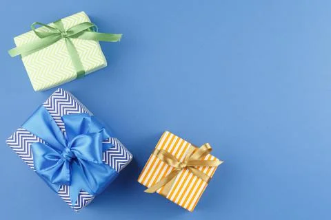Present in gift paper on the table. Stock Photos