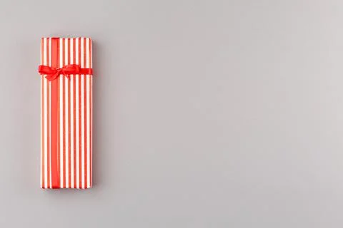 Present in gift paper on the table. Stock Photos