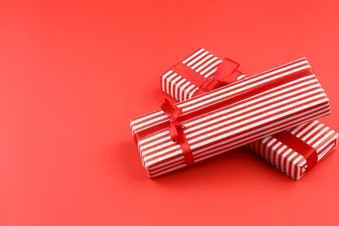 Present in gift paper on the table. Stock Photos