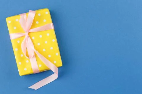 Present in gift paper on the table. Stock-Fotos