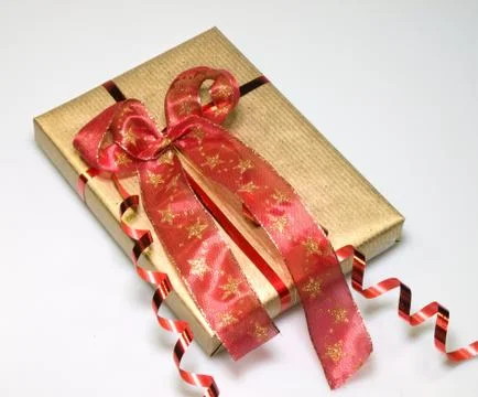 Present in gold and red Stock Photos