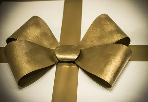 A present with a golden bow Stock Photos