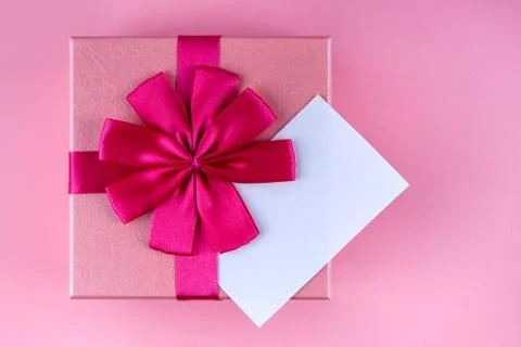 Present with note with red heart on pink background mock up, copyspace Stock Photos