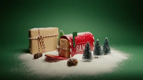 Present for Santa Claus in open red mailbox with Christmas decor under snow 4K Stock Footage 255315918