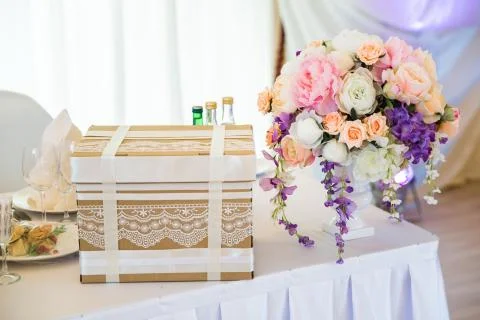 Present woth flowers on the table 库存照片