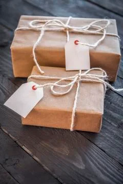 Present wrapped with brown paper and tags Stock Photos